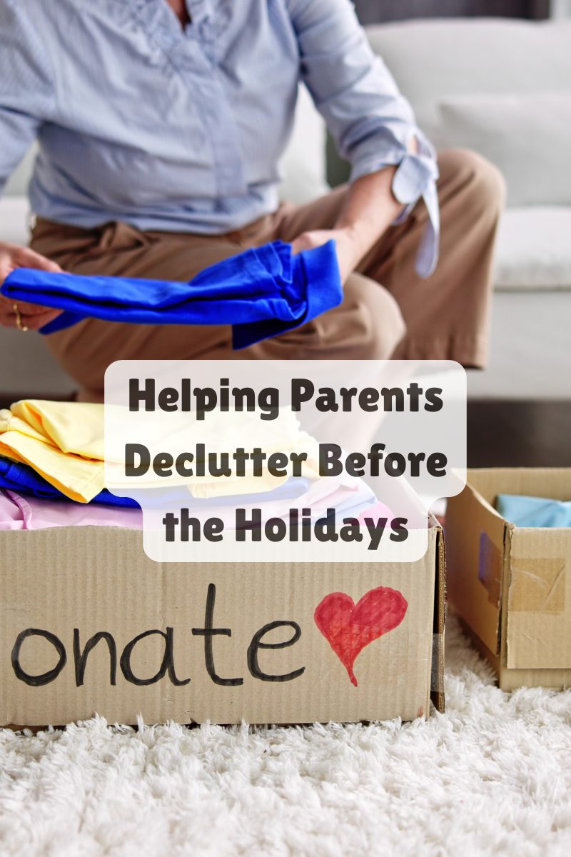 Senior parents sorting through keepsakes with their adult daughter while preparing for a holiday move.