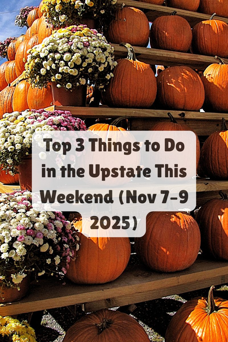 Stacked pumpkins and fall mums at an outdoor Upstate South Carolina festival, symbolizing seasonal weekend events.