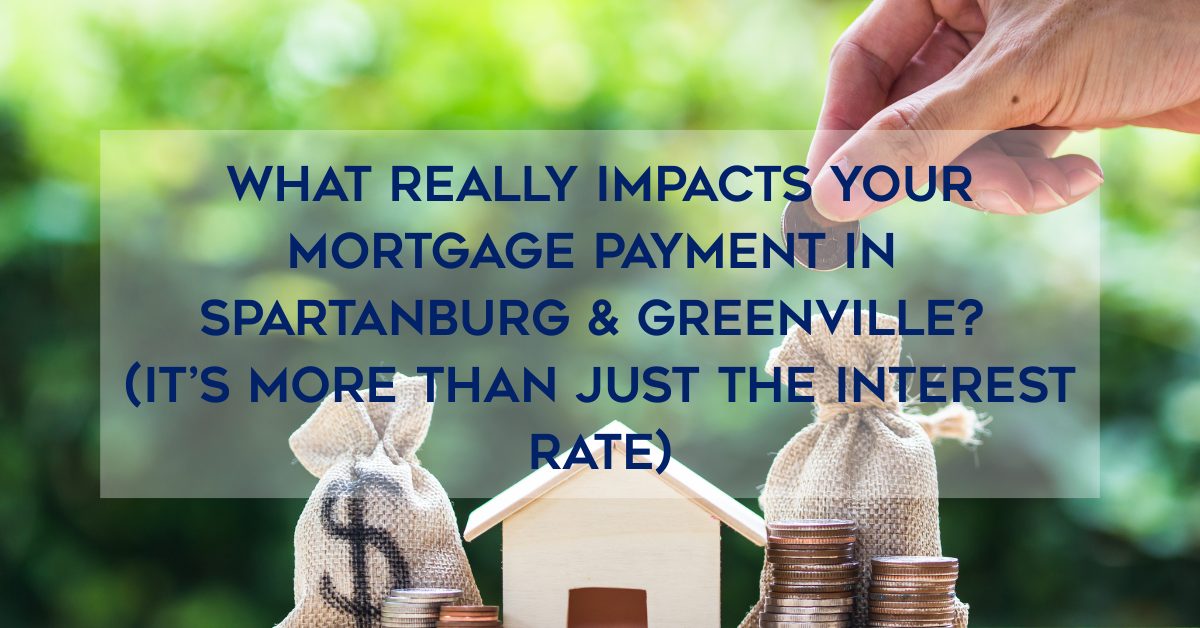 Hand placing coins into money bags beside a small house model with text overlay reading “What Really Impacts Your Mortgage Payment in Spartanburg & Greenville? (It’s More Than Just the Interest Rate).”